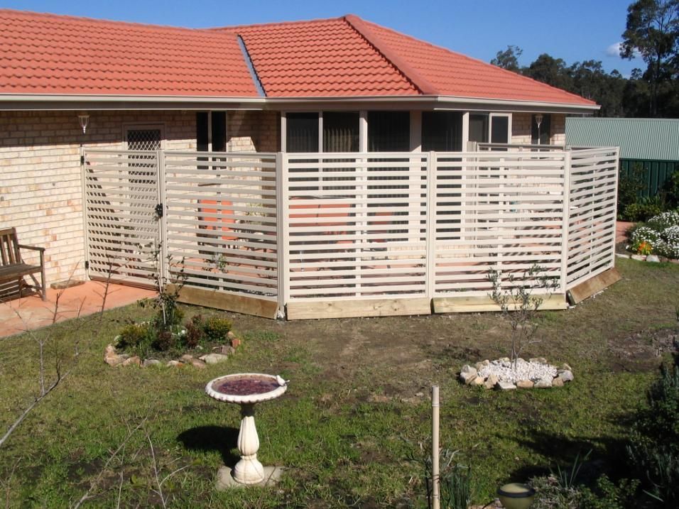 A House With a Bird Bath in Front of It — Hunter Valley Lattice in Cessnock, NSW