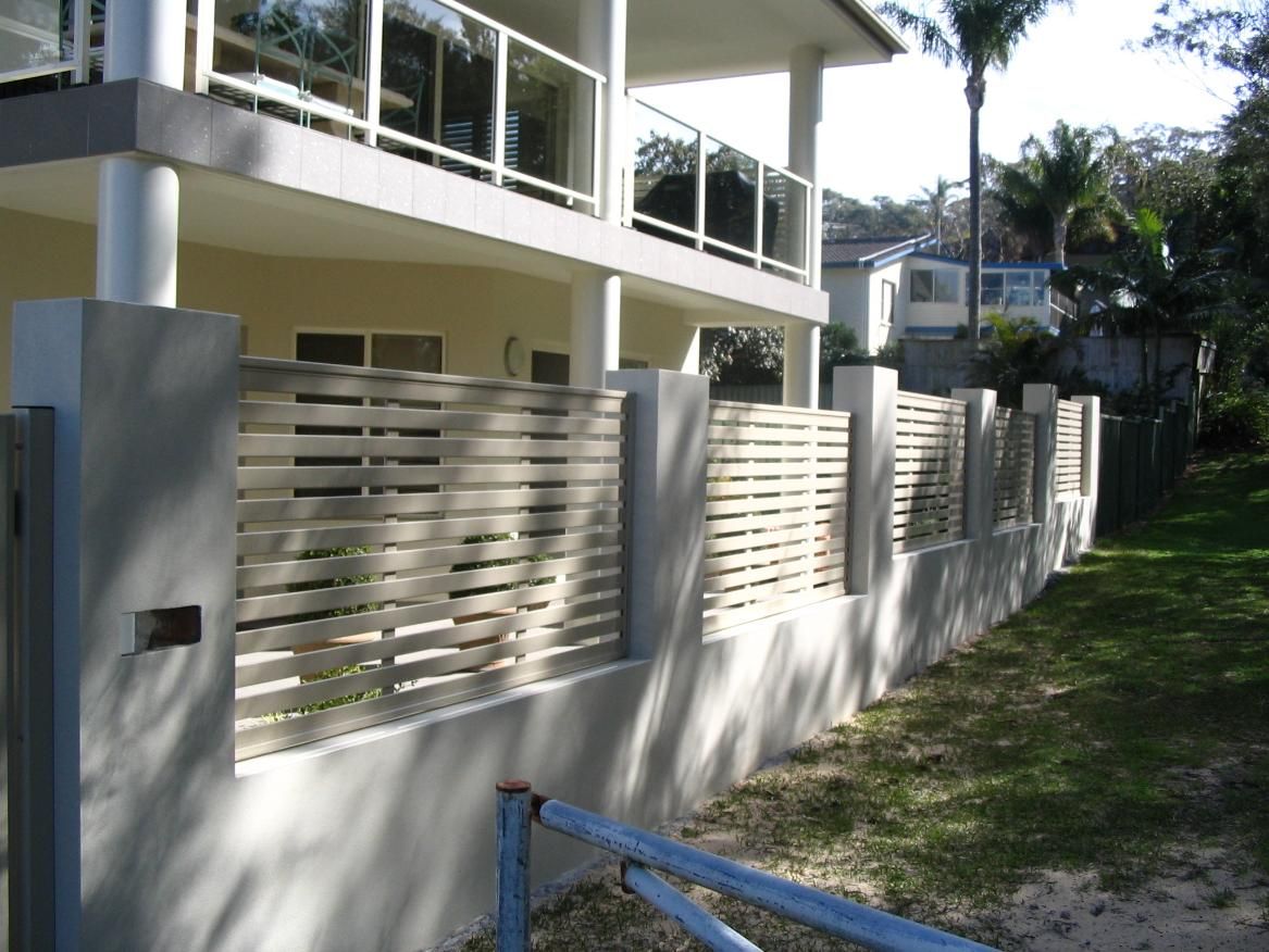 A White House With a Fence in Front of It — Hunter Valley Lattice in Newcastle, NSW