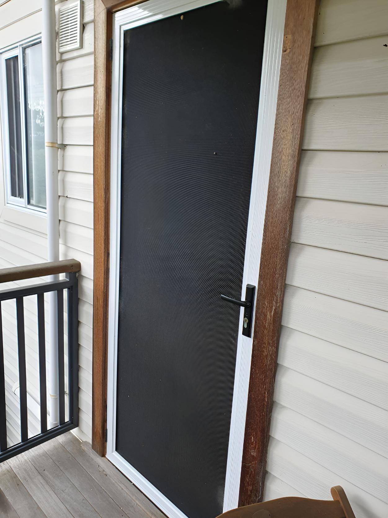 A Black Door With a White Frame is on a Balcony — Hunter Valley Lattice in Cessnock, NSW