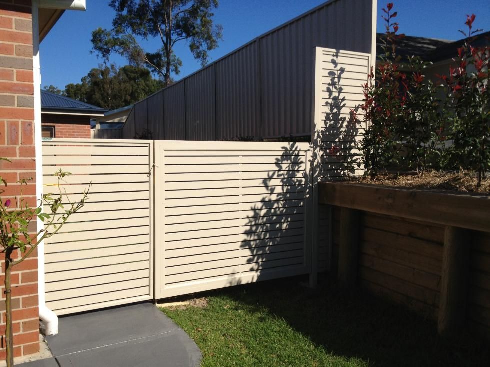 A White Fence is in the Backyard of a House — Hunter Valley Lattice in Kurri Kurri, NSW
