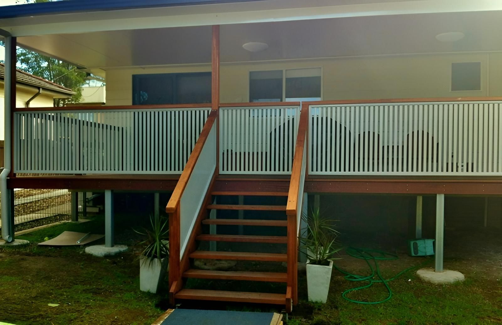 A House With a Wooden Deck and Stairs Leading Up to It — Hunter Valley Lattice in Port Stephens, NSW