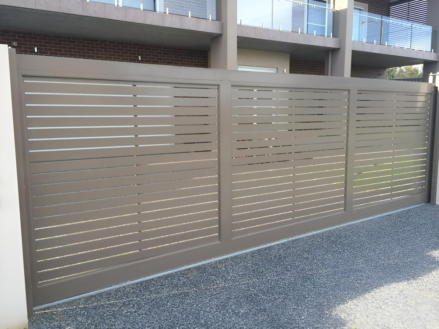 A Sliding Gate is Sitting in Front of a Building — Hunter Valley Lattice in Kurri Kurri, NSW