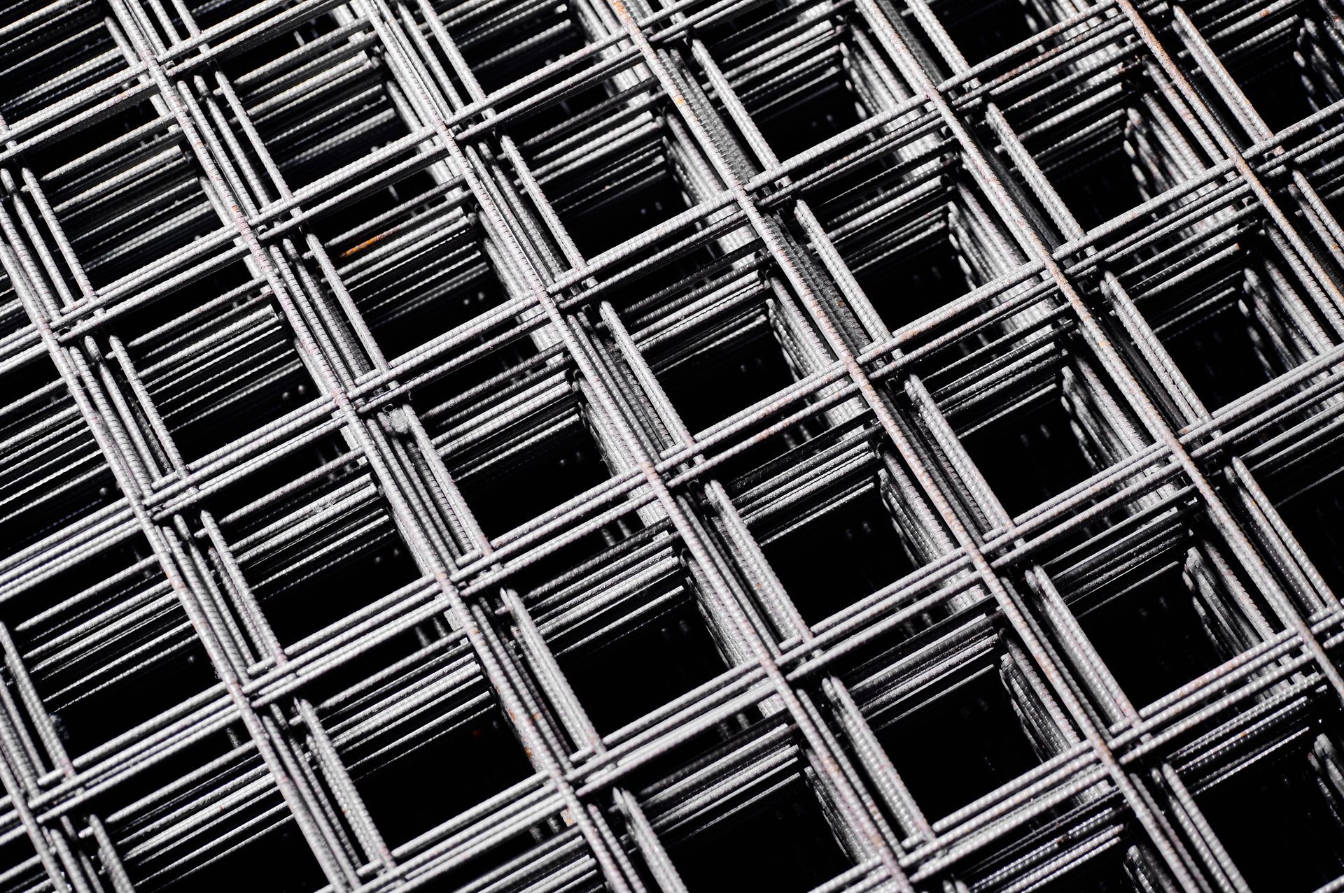 Close-up of stacked welded wire mesh in a cold plant storehouse.