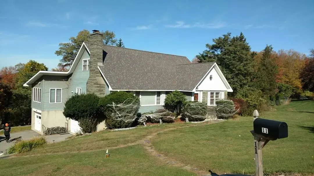 A large house with a mailbox in front of it