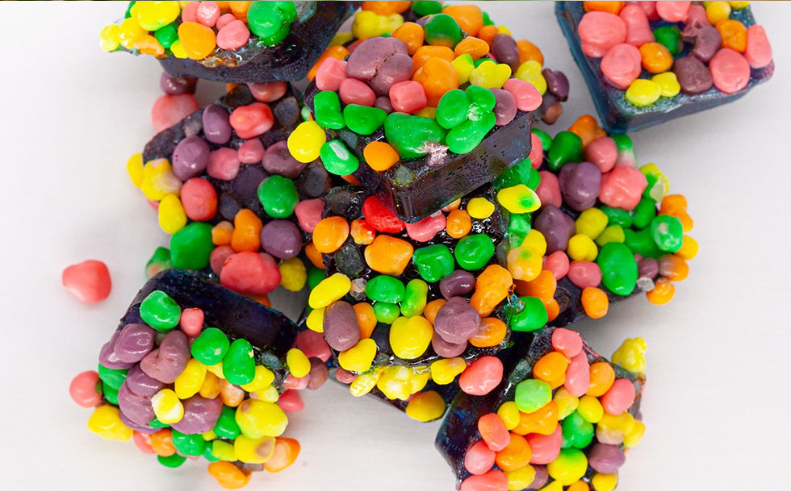 A close up of a pile of candy on a table.