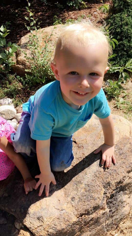 Toddler in blue shirt Smiling - Learning Center in Northglenn, CO