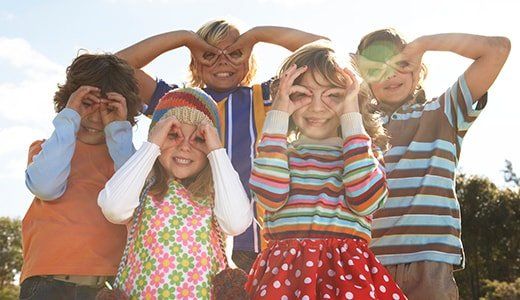 Happy children doing gestures - Day Care Center in Northglenn, CO