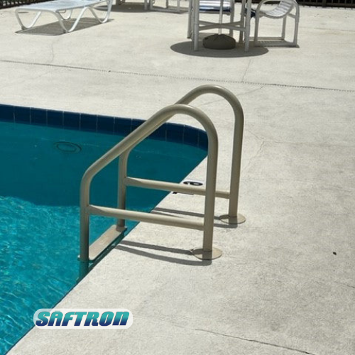 Pool ladder in a pool. Beige handrails contrast with the blue water and light concrete — NQ Pool Supplies in Smithfield, QLD