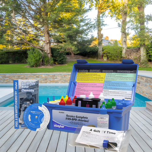 Pool cleaning tools: net, brush, vacuum, hose, chemical test kit near a pool.— NQ Pool Supplies in Smithfield, QLD