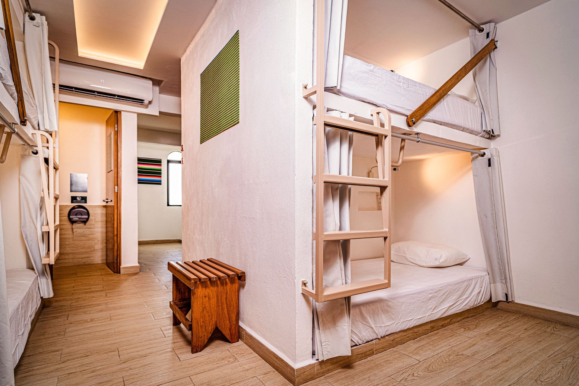 A bunk bed with a ladder leading up to it in a room.