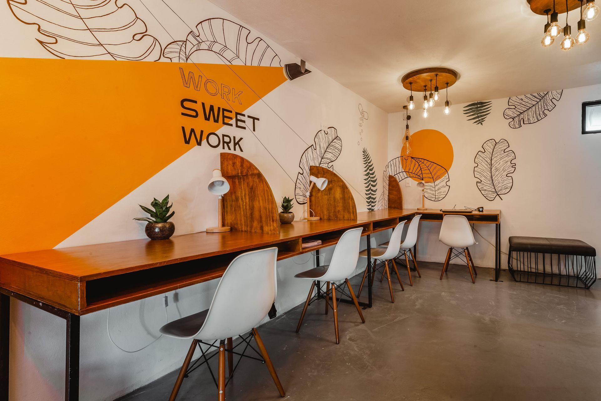 A room with a mural on the wall that says `` sweet work ''.