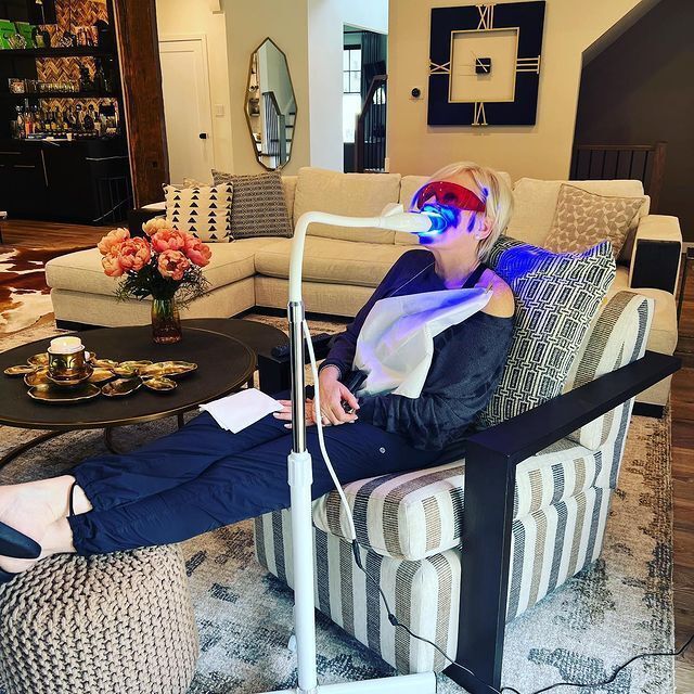 Woman on Couch Having Teeth Whitening — Marlton, NJ — glw GO LIGHTER + WHITER