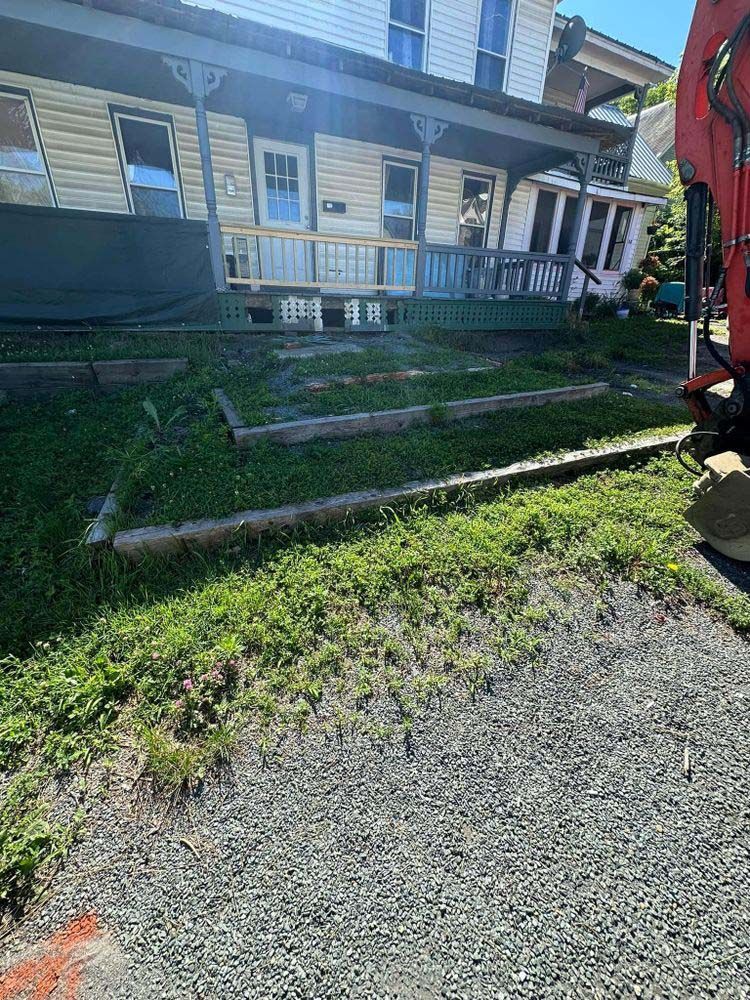 A red truck is parked in front of a house.