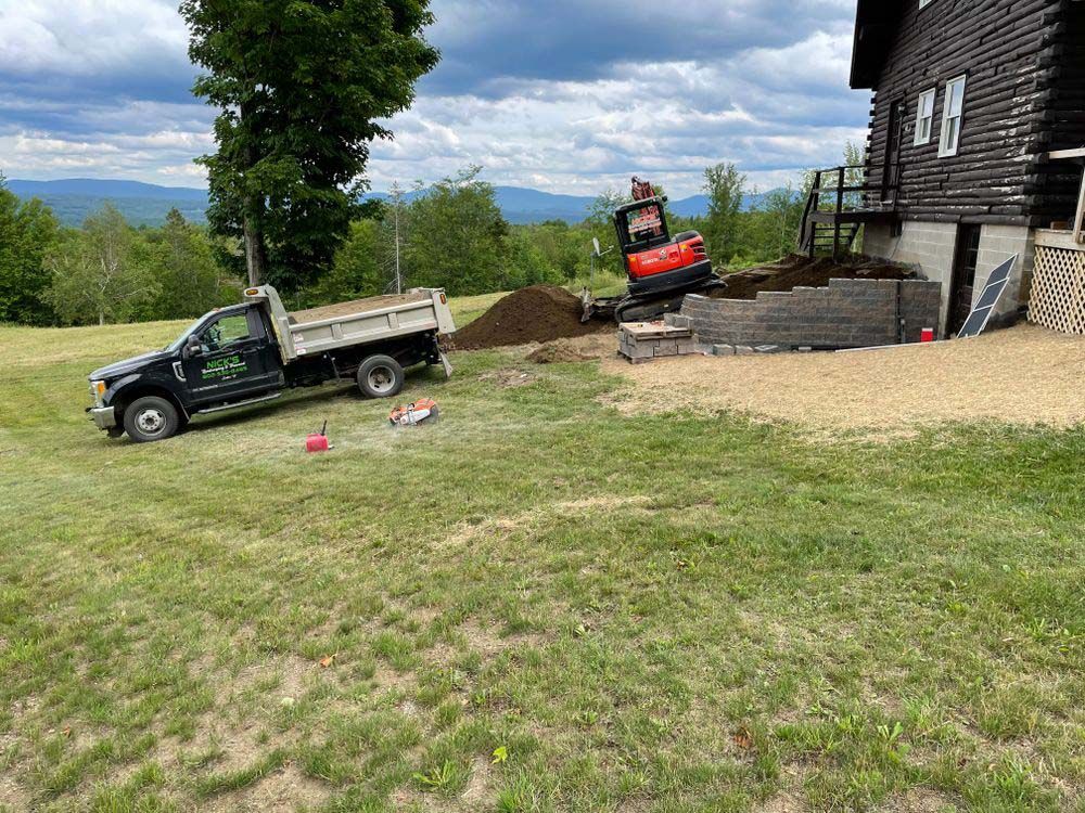 A dump truck is parked in front of a house.