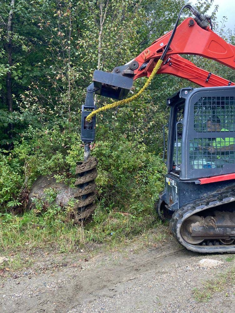 A bulldozer is digging a hole in the ground.