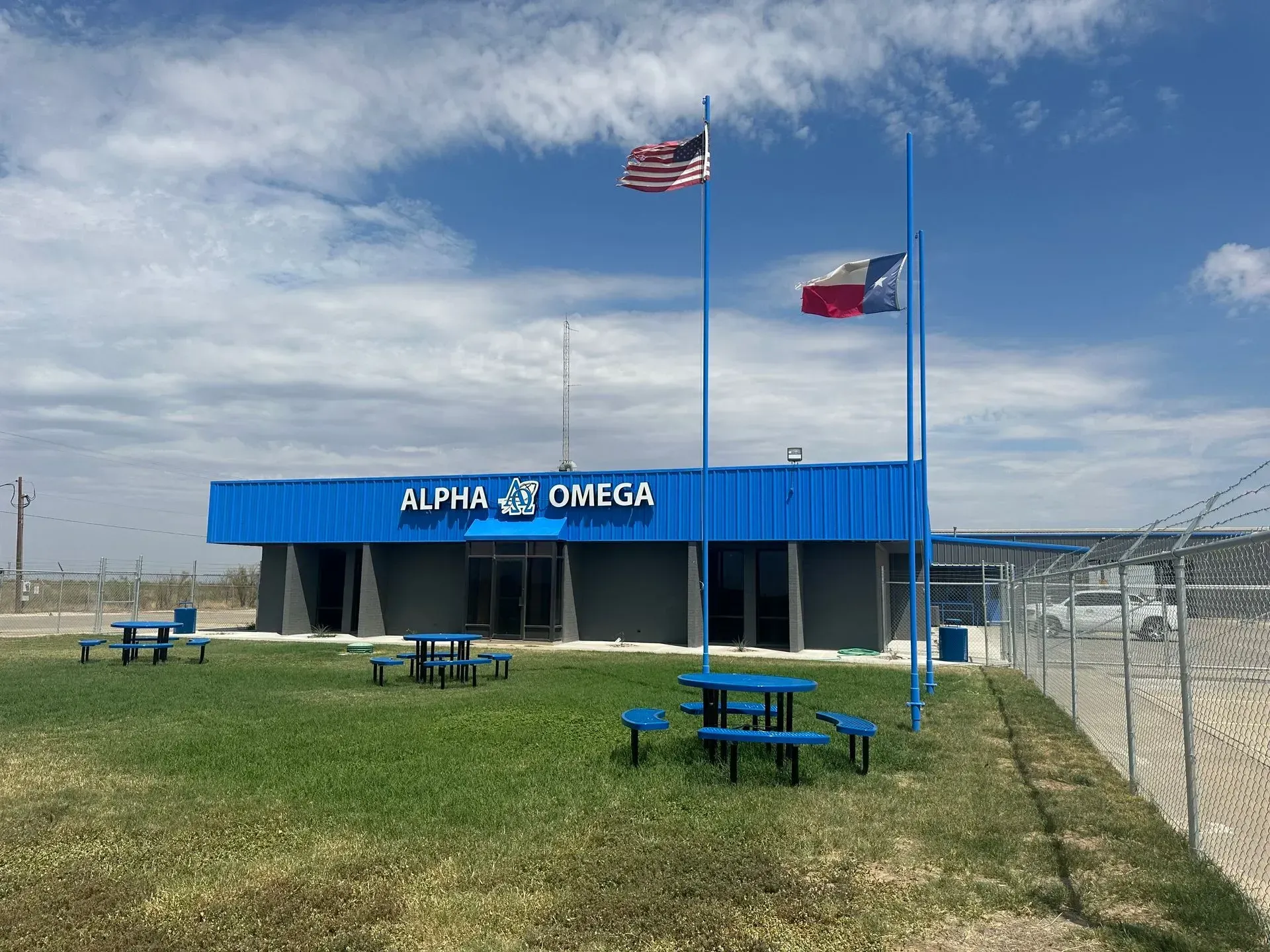 A blue building with the word alpha on it