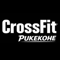 Logo for CrossFit Pukekohe: "CrossFit" in large letters above "PUKEKOHE" in smaller letters, all in light grey.