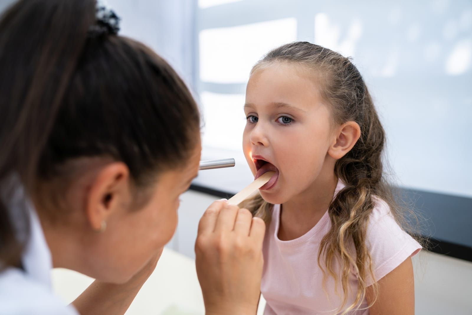 pediatric-ent-examines-child-girl-with-inflamed-adenoids