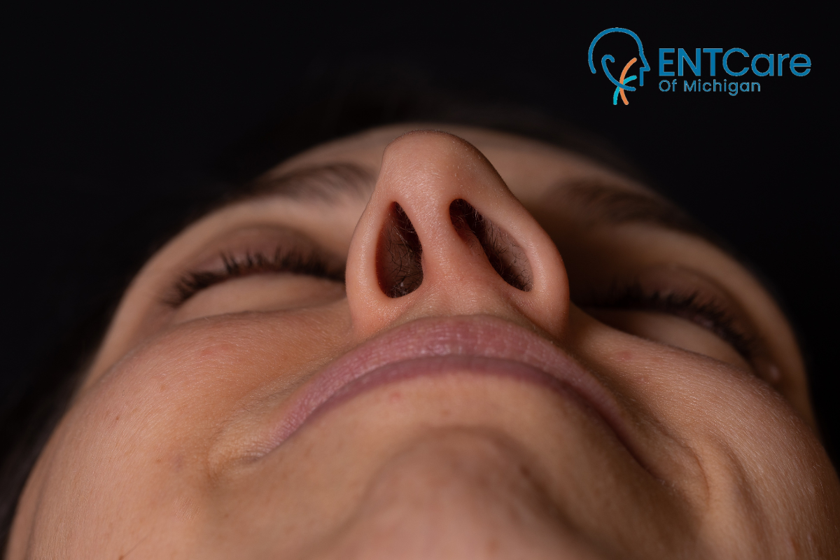 A close up of a woman with a severe deviated septum