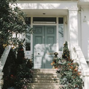 The front door of a house has the number 1 on it