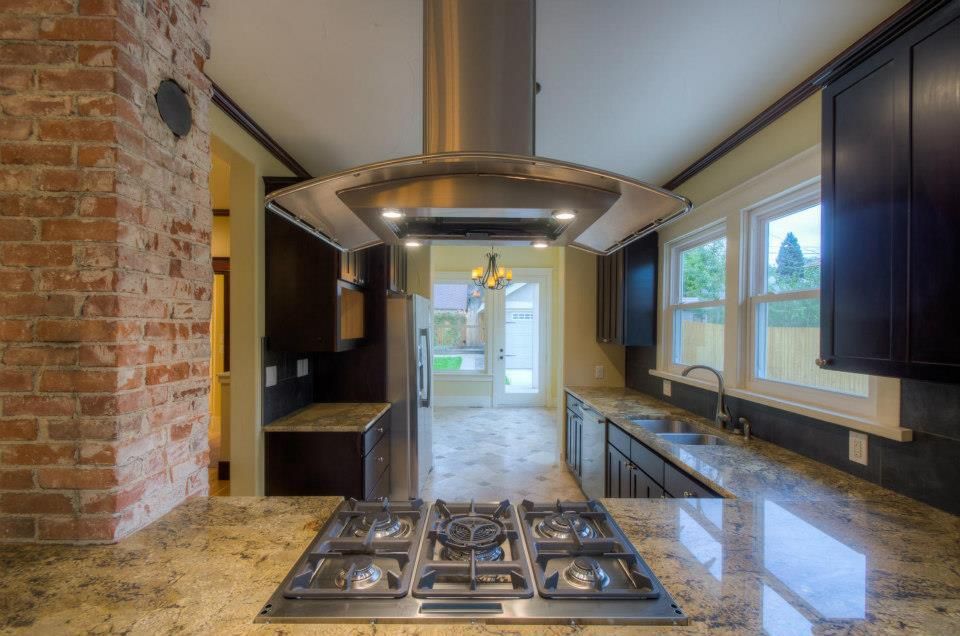 A kitchen with stainless steel appliances and granite counter tops