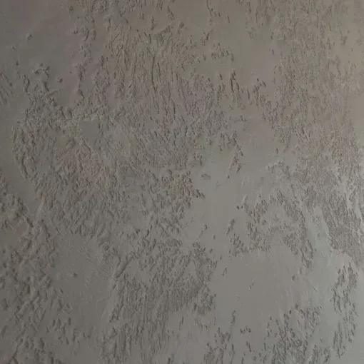 Textured gray wall with rough, mottled finish.