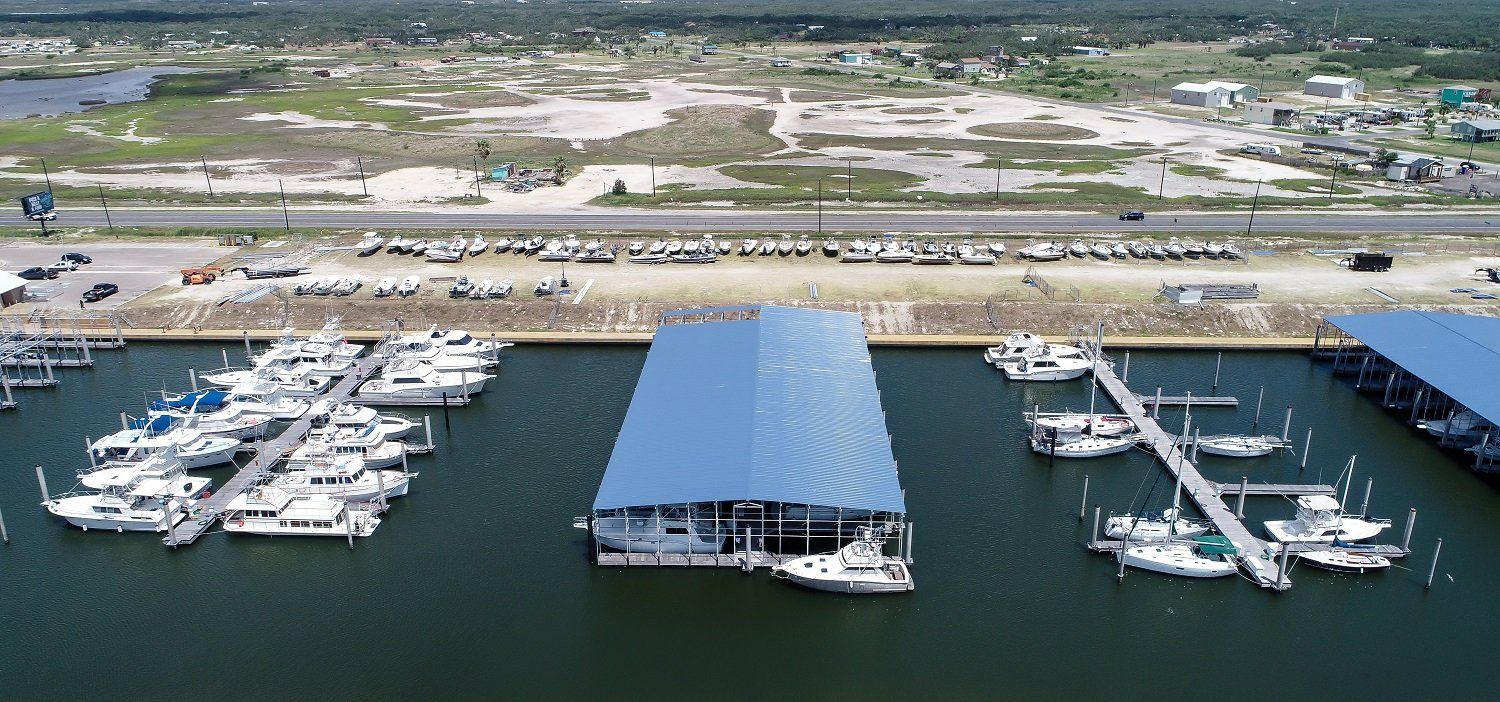 An aerial view of a marina with boats docked in it