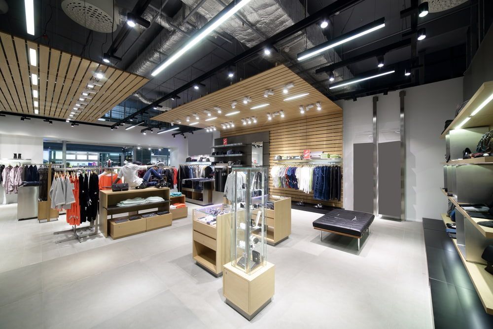 A Large Clothing Store With a Wooden Ceiling and Lots of Clothes on Display — Gray Projects in Woodford, QLD