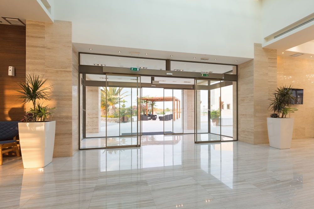 A Large Lobby With Sliding Glass Doors in a Hotel — Gray Projects in Woodford, QLD