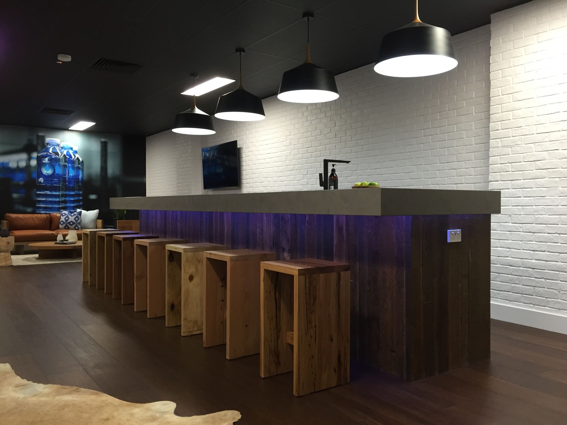 A Modern Bar Counter With Wooden Stools — Gray Projects in Woodford, QLD