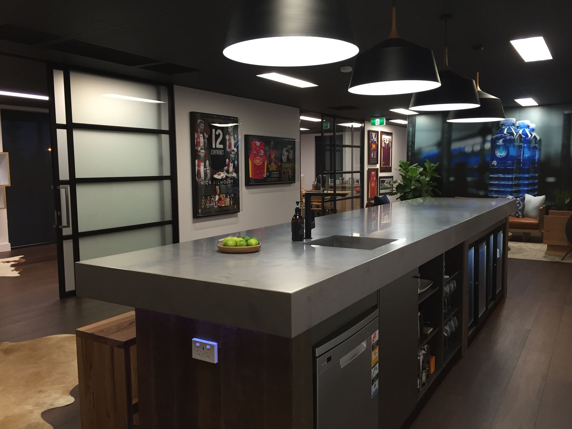 A Modern Office Kitchen Features a Long Dark Countertop — Gray Projects in Woodford, QLD