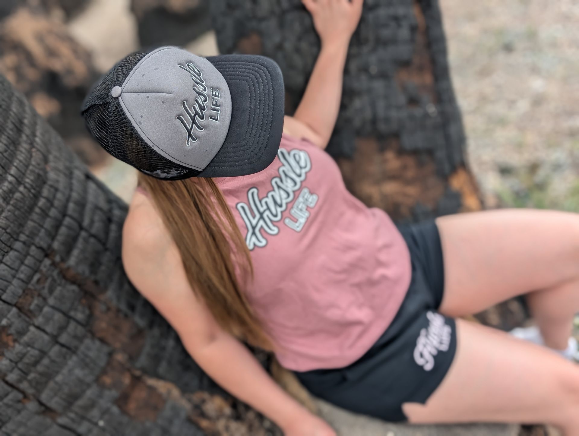 A woman wearing hussle brands