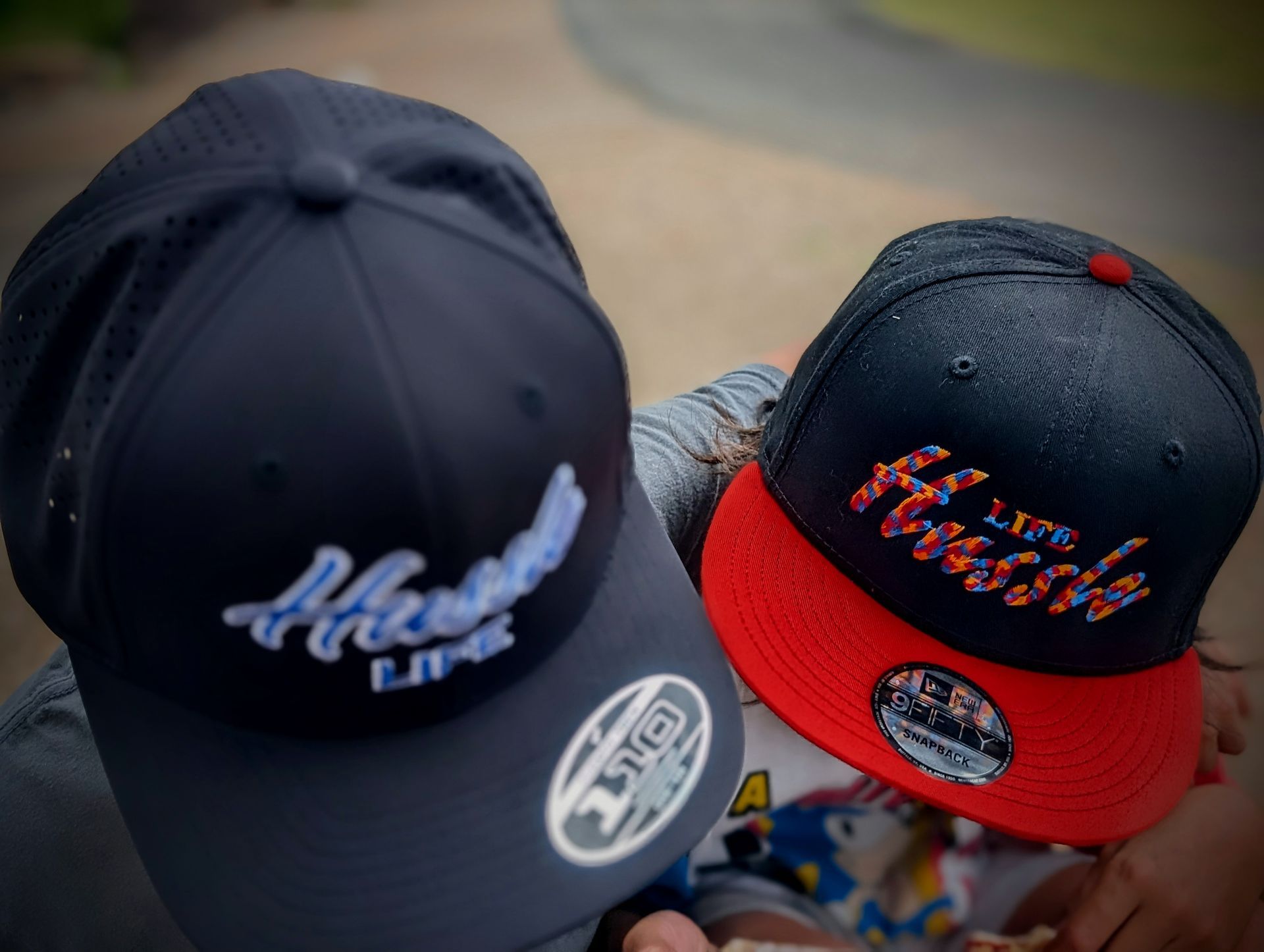 A person wearing a hat that says hustle on it