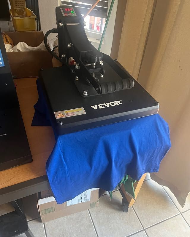 A vevor heat press machine is sitting on a table