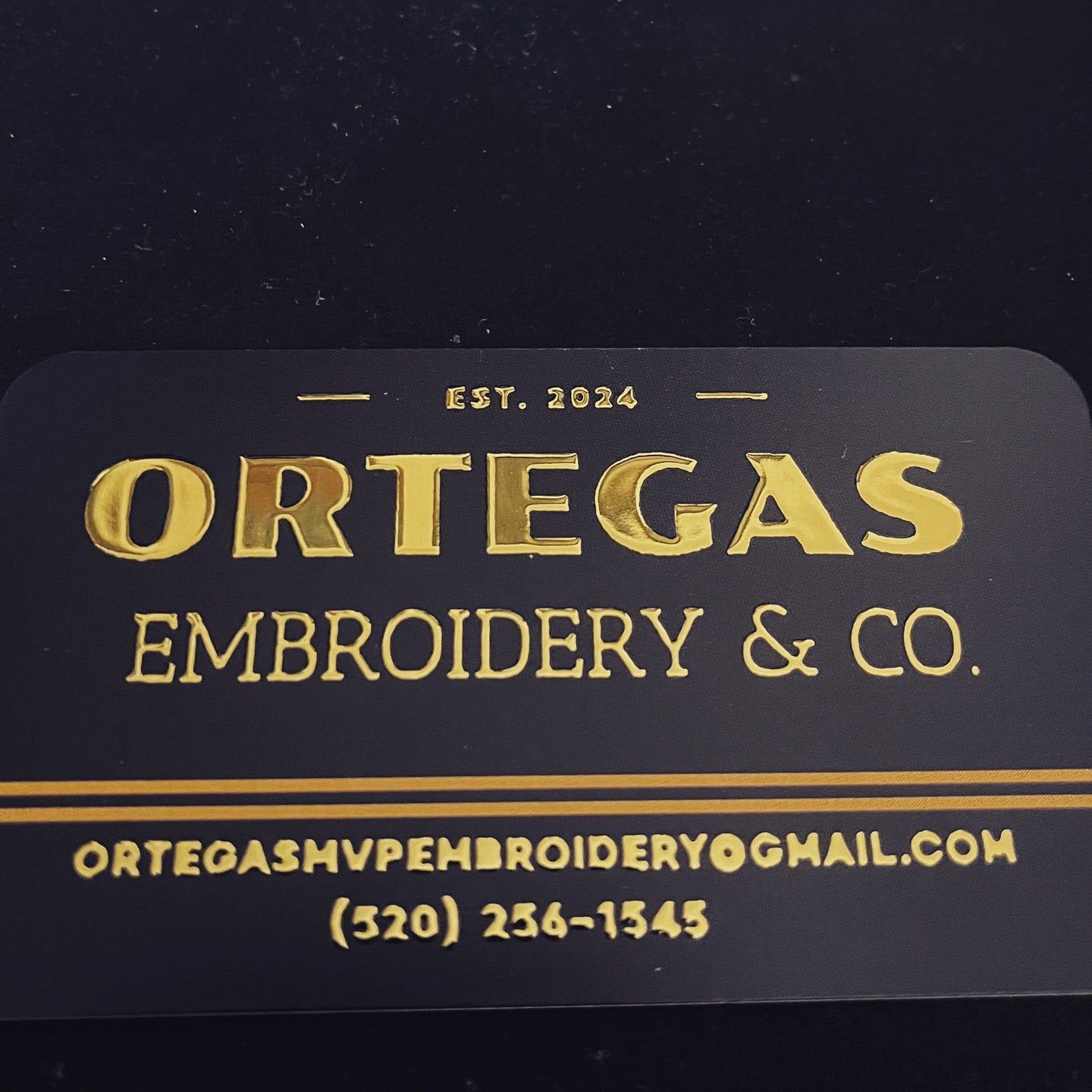 A business card for ortegas embroidery & co.