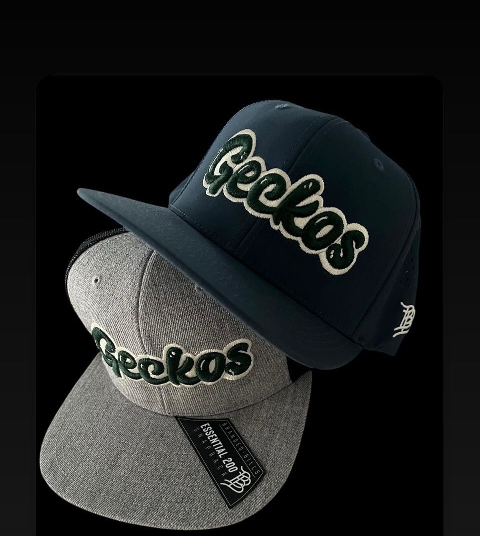 A shelf full of hats and spools of thread