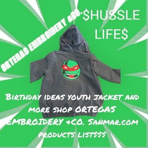 A jacket and a t-shirt are hanging on a rack