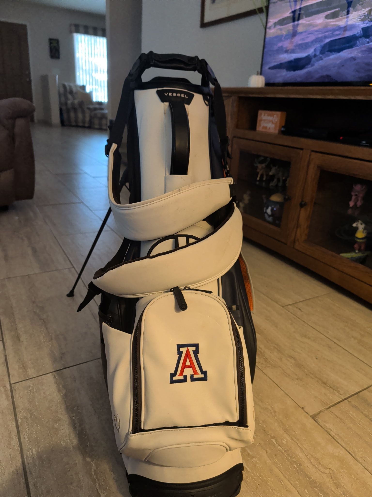 A person wearing a hat that says embroidery & co. on it