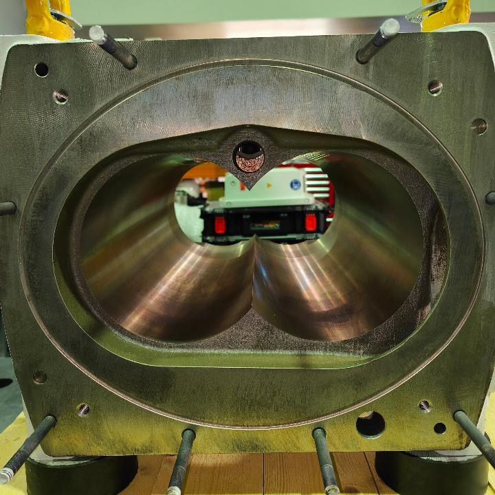 A close up of a metal object with a hole in the middle