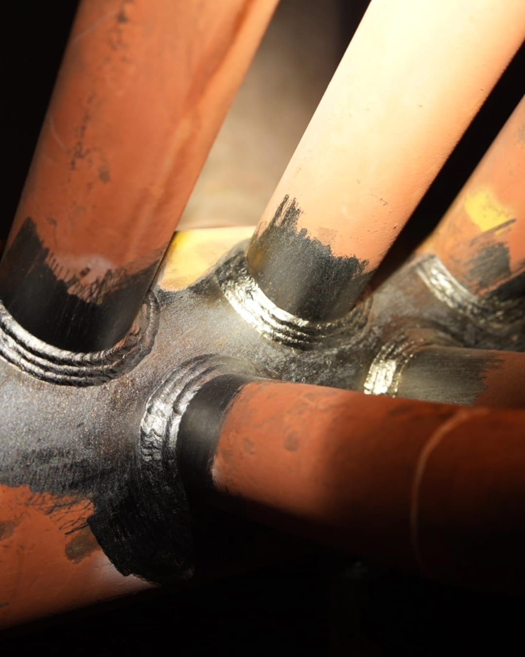 A close up of a pipe with black paint on it