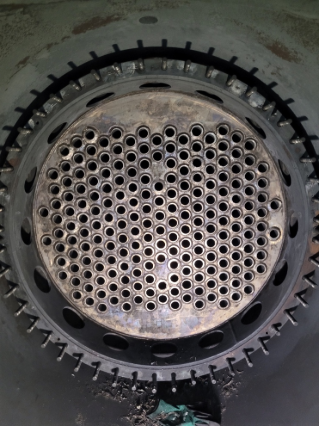 A close up of a metal object with holes in it