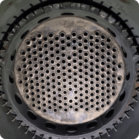 A close up of a metal object with holes in it
