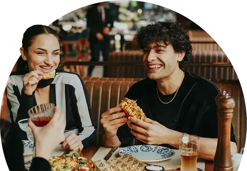 A young couple enjoying a meal
