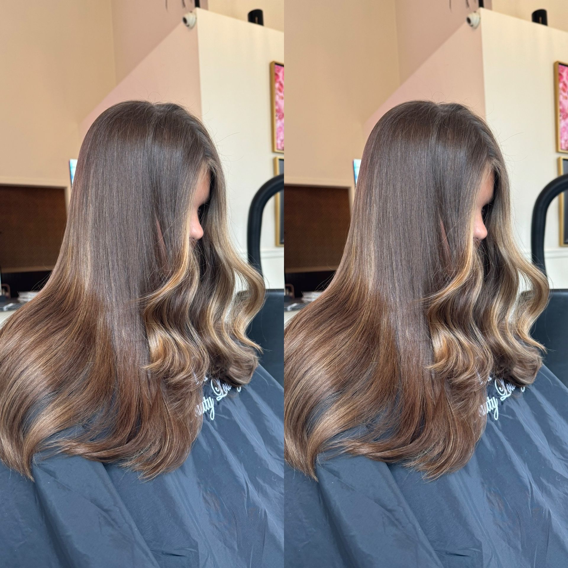 A woman with long brown hair is sitting in a chair
