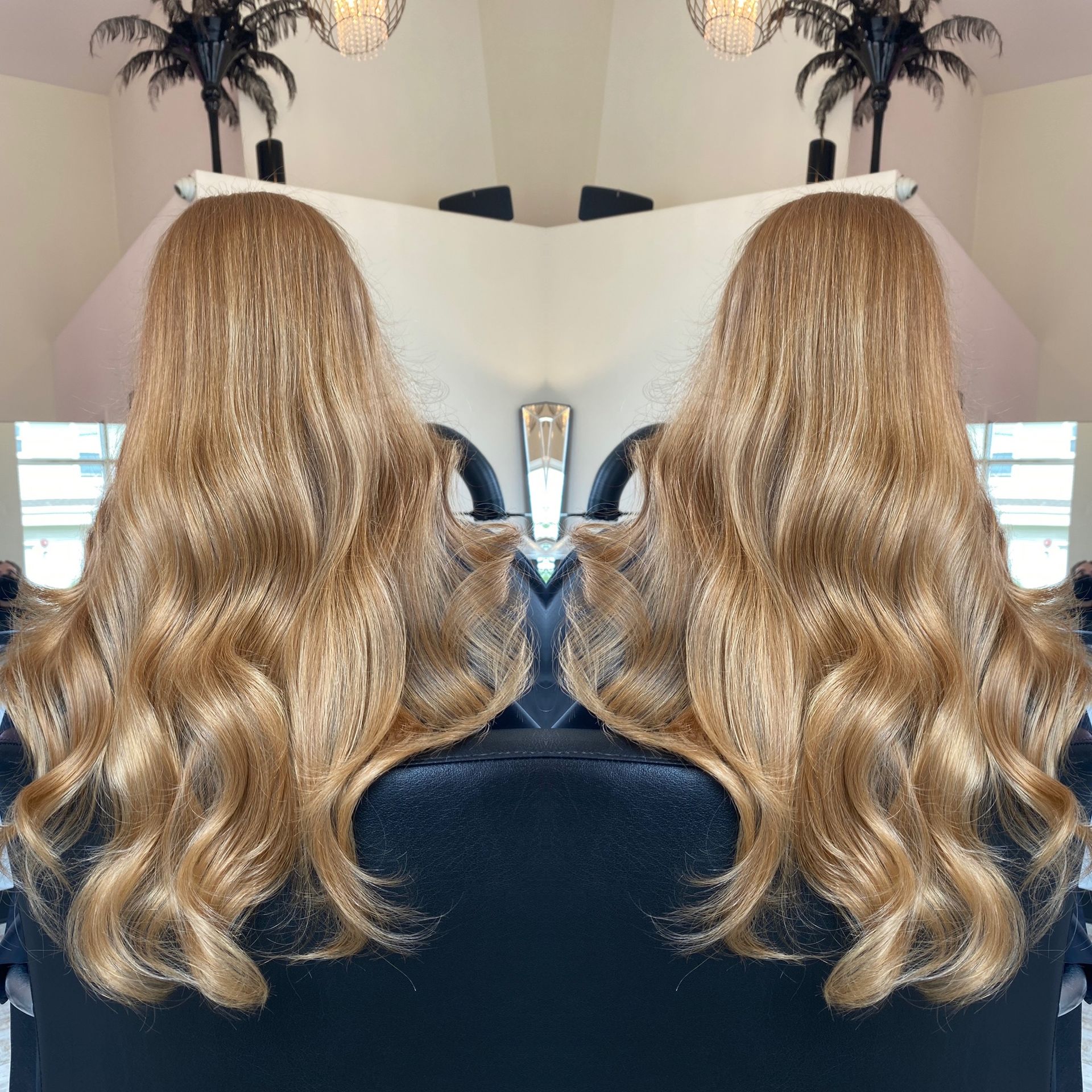 A reflection of a woman 's hair in a mirror