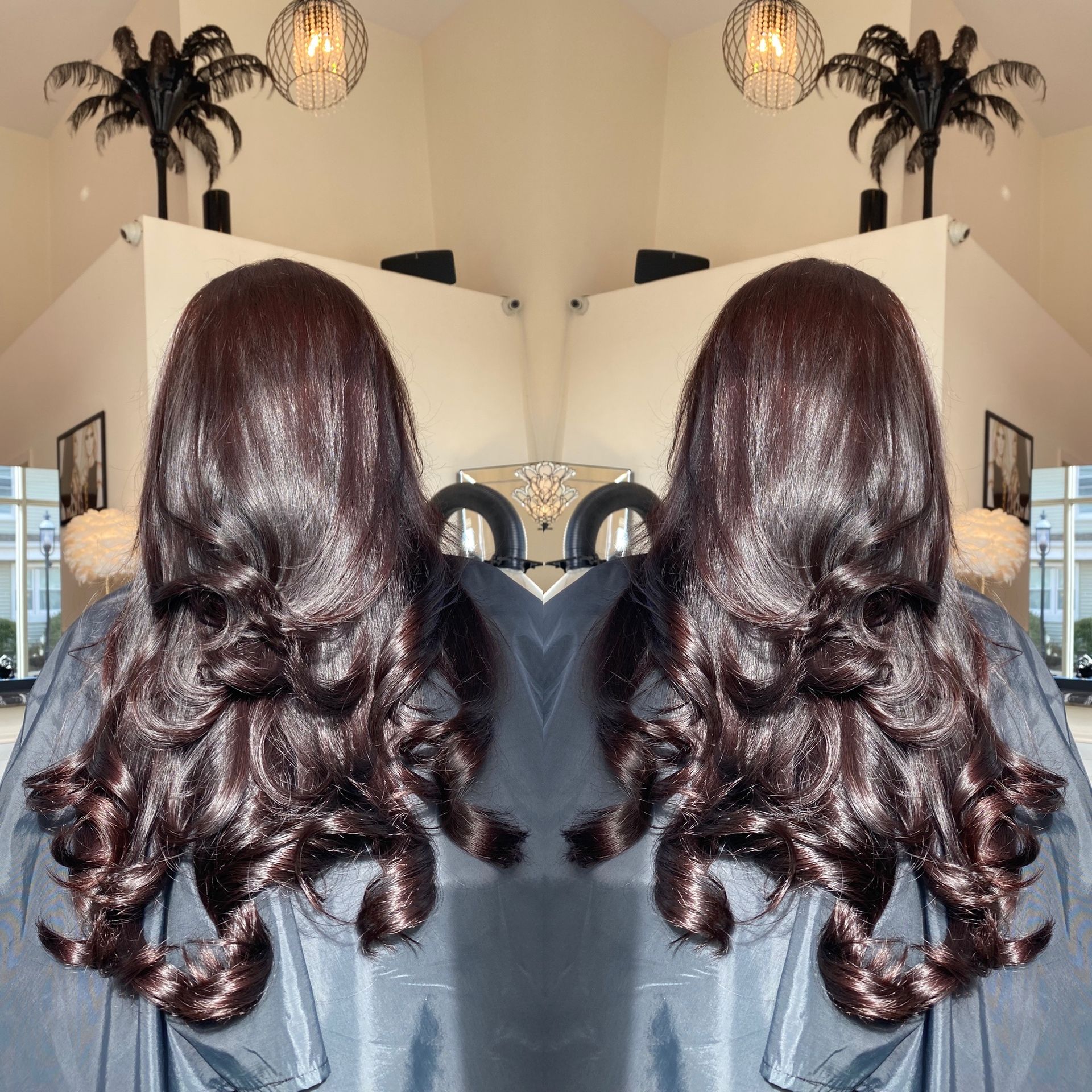 A reflection of a woman 's hair in a mirror