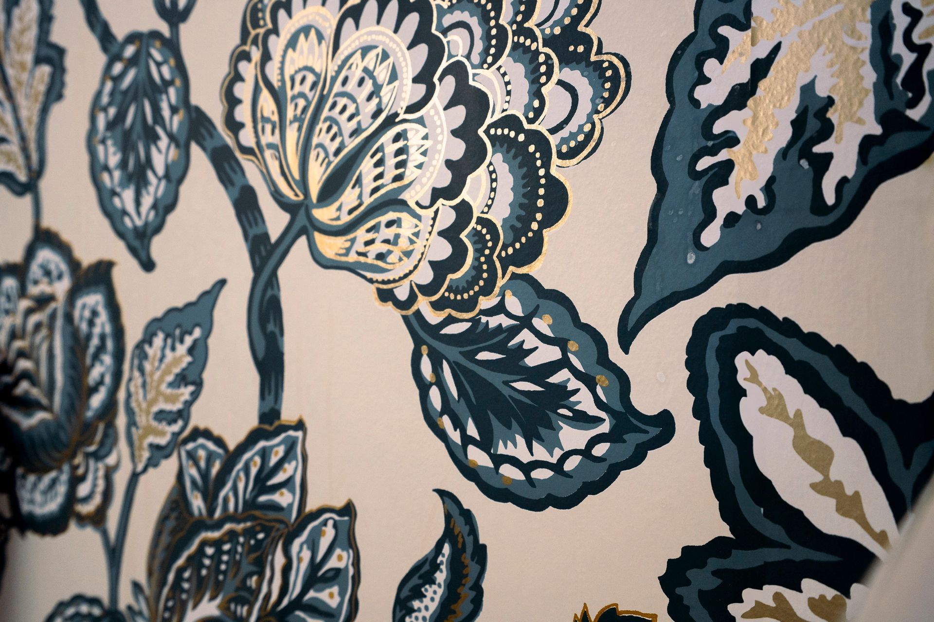 A close up of a floral pattern on a wall