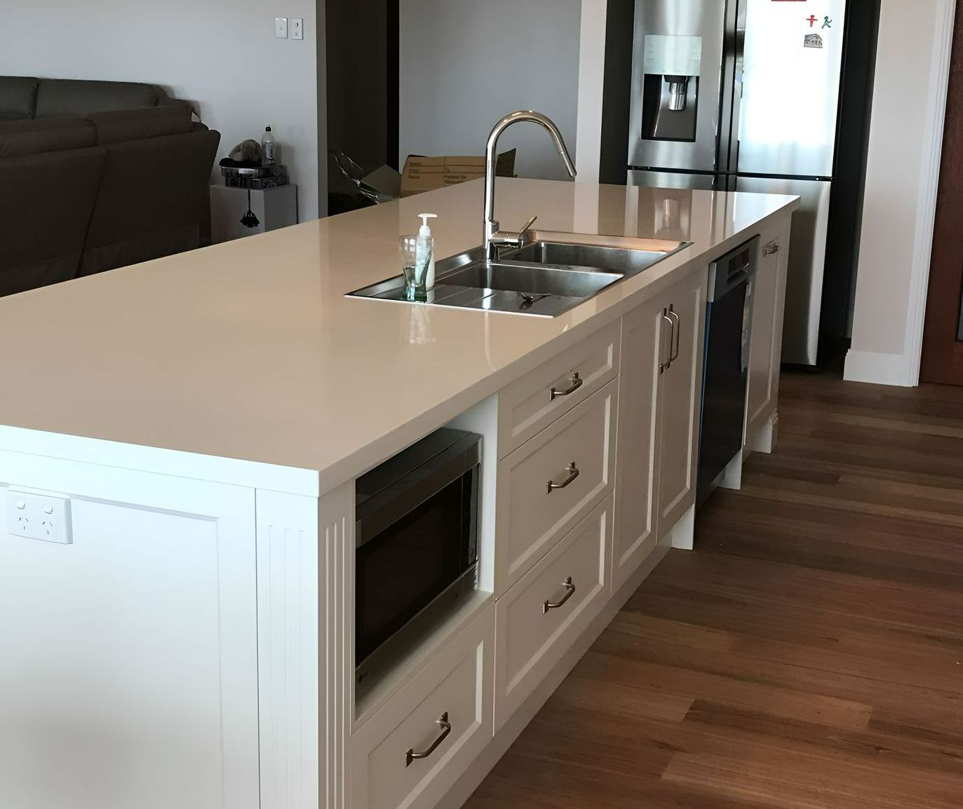 A Kitchen With White Cabinets and Stainless Steel Appliances — Tefa Kitchens & Joinery in Rutherford, NSW