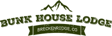 The bunk house lodge logo has a mountain in the background.