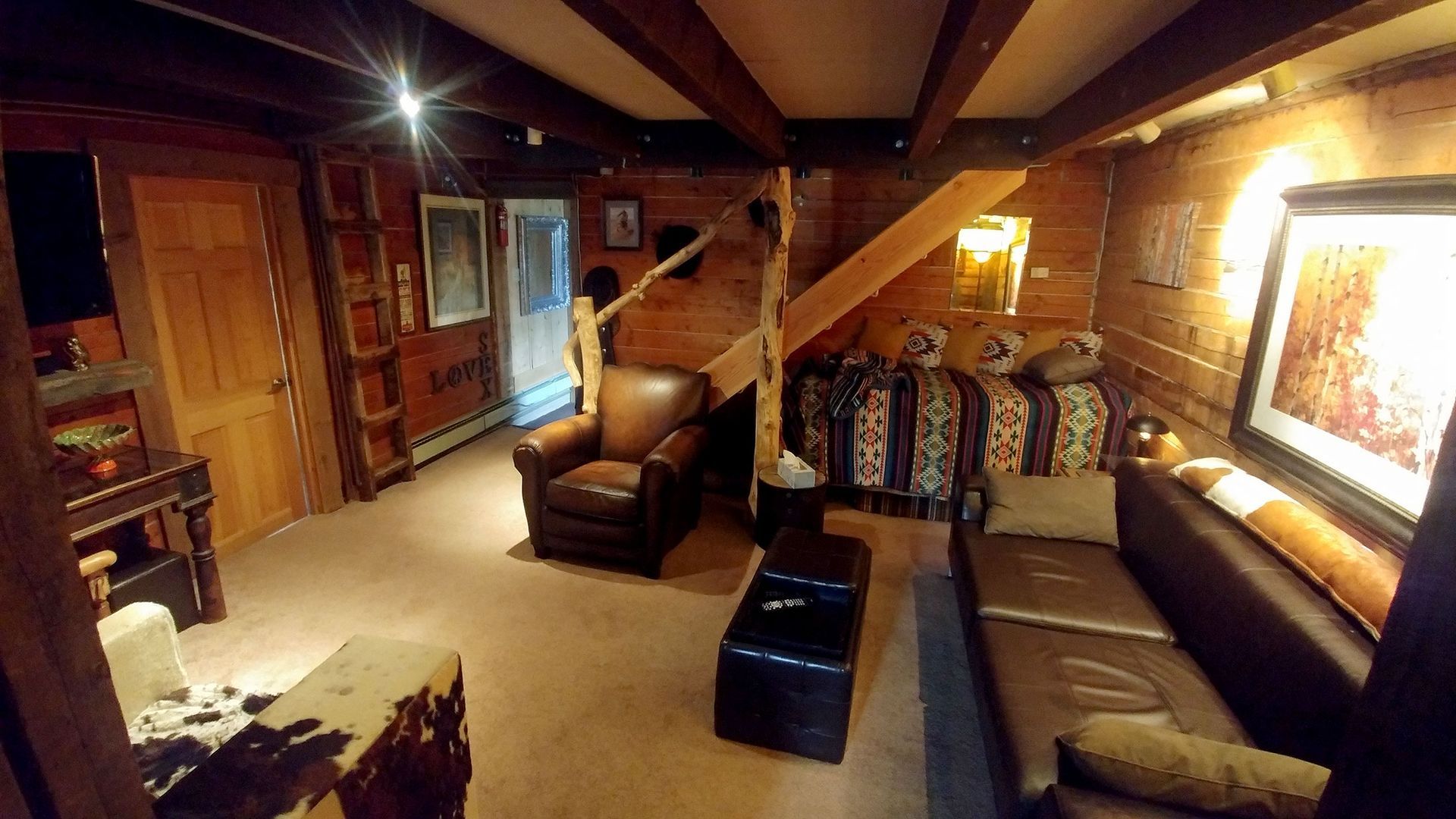 A bedroom with two bunk beds and a rug.